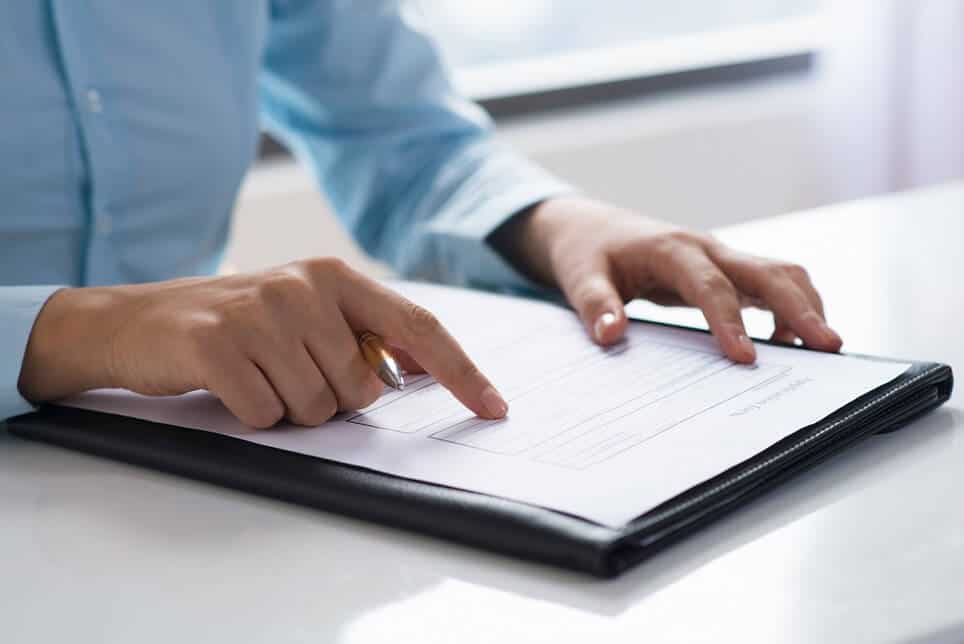 woman reading divorce documents